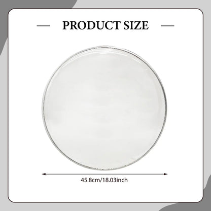 Clear circular glass snare drum head with transparent replacement design and thin metallic rim for sound control