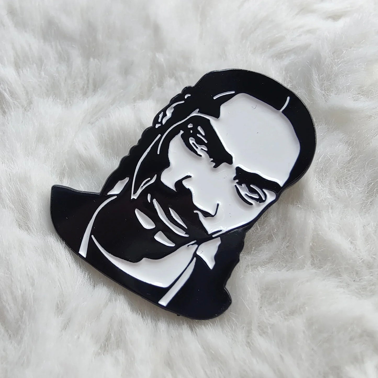 Black and white enamel rapper enamel pin featuring a stylized snoop dogg hip hop godfather badge jewelry gift
