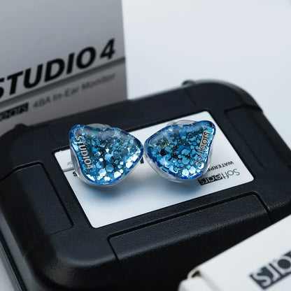 Blue glitter-filled softears studio series studio4 in-ear monitors with clear heart-shaped housings and crossover professional hifi design