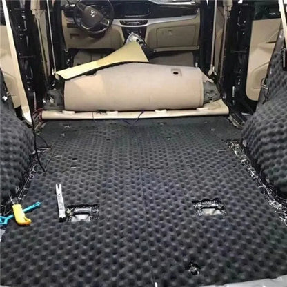 Black textured rubber floor mat with perforated surface and wear patterns for insulation cotton vehicle door denoise tool