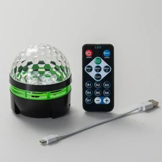Clear faceted crystal globe sound activated led disco light rotating with black base and green accent for home ktv bar