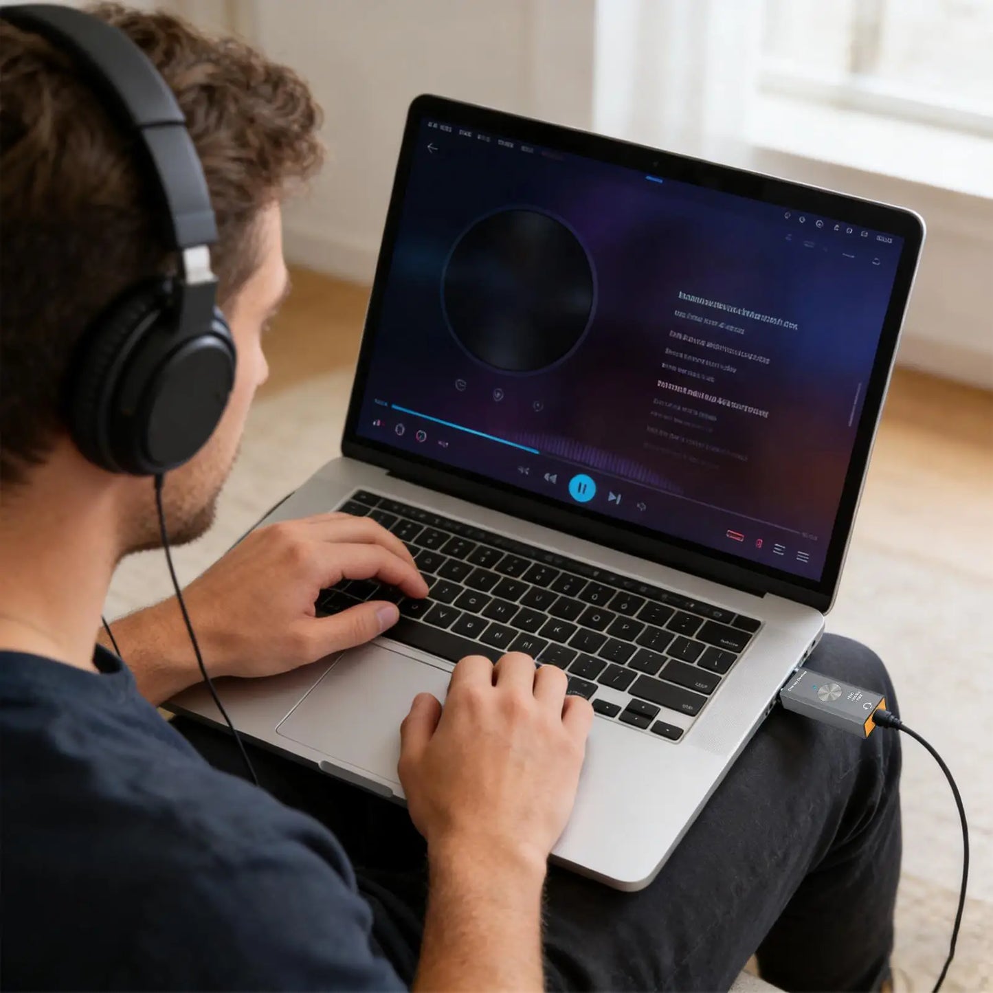 Black over-ear headphones with padded earcups paired with noise reduction adapter for studio podcast game live streaming use