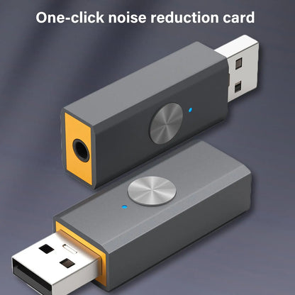Gray and orange usb noise reduction converter card with circular metallic button for studio podcast game live streaming