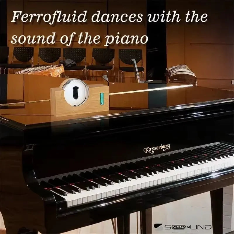A sleek black kayserburg grand piano with polished finish and white ebony keys featuring magnetic fluid pickup
