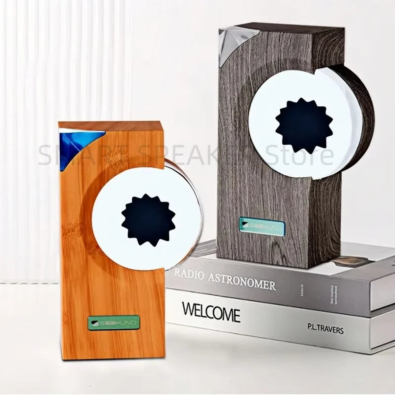 Two sleek wireless speakers in warm wood grain and dark gray wood with magnetic fluid and equipment motion sensor