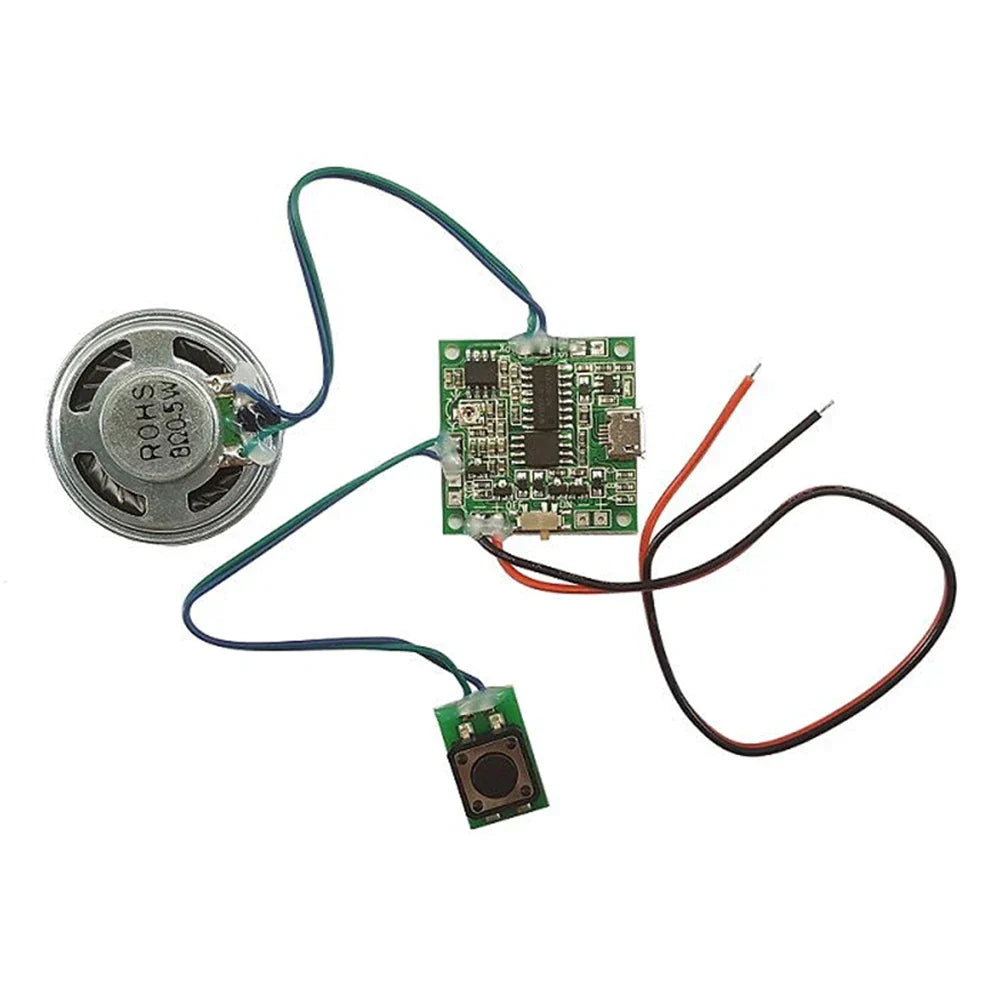 Silver circular sound recorder module with green circuit board and black loudspeaker button control for diy music box