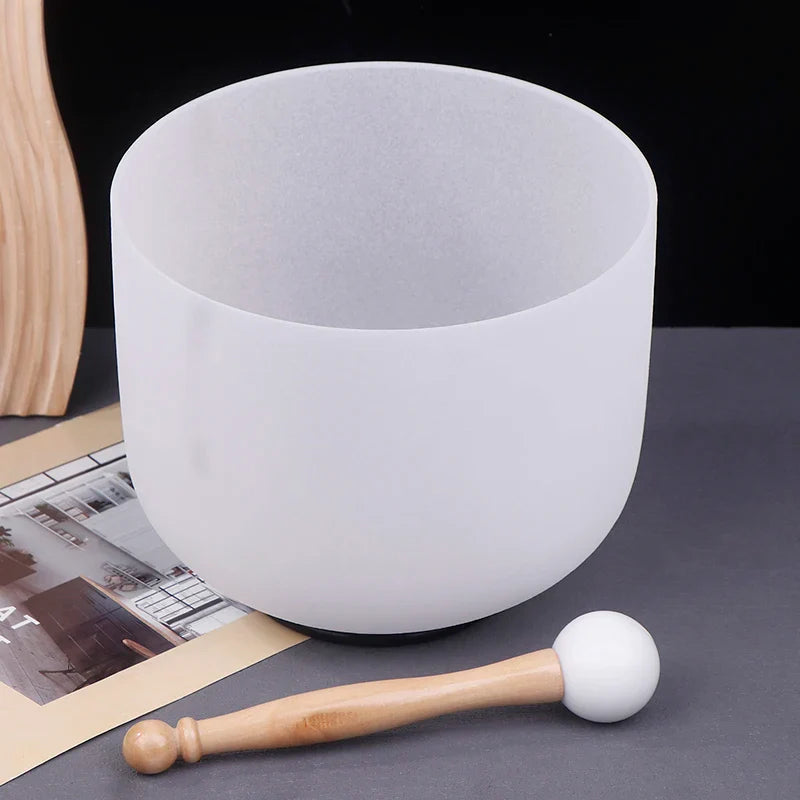 A frosted white quartz 8 inch crystal singing bowl with wooden mallet for sound therapy manual measurement included