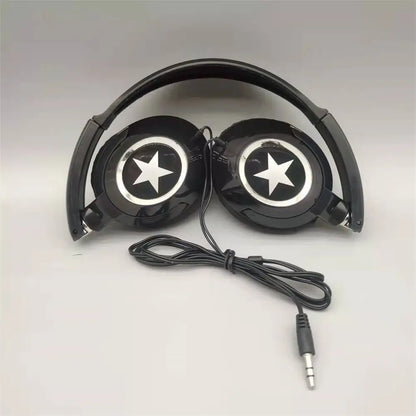 Black over-ear headphones with glossy finish and white star logos connected by coiled cable flexible adjustable headset