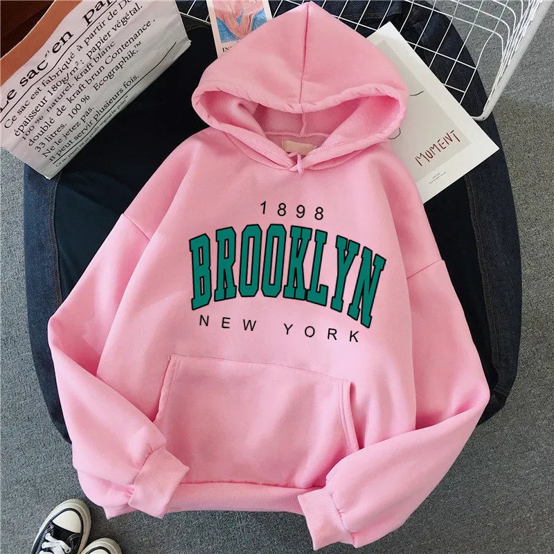 Pink fleece hoodie with brooklyn new york print in green and black featuring a hot selling couple hoodie sweatshirt design