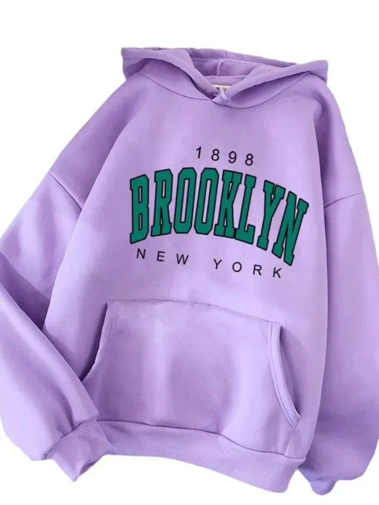 A soft lavender fleece hoodie hot selling with bold green brooklyn printed couple graphic and 1898 year detail