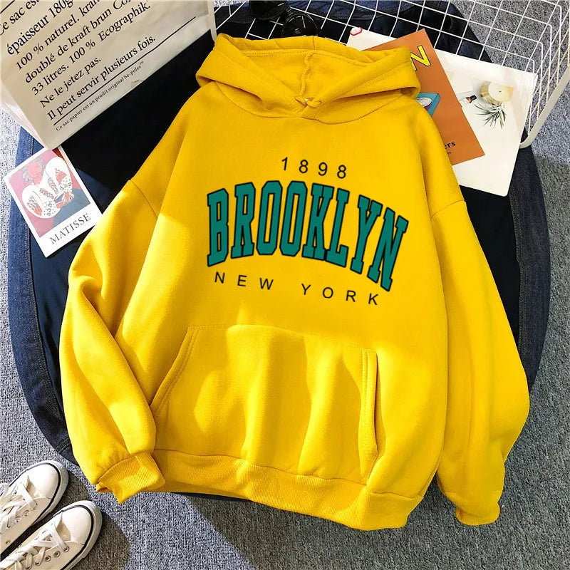 Bright yellow fleece hoodie with brooklyn new york teal and black print, a hot selling couple hoodie sweatshirt