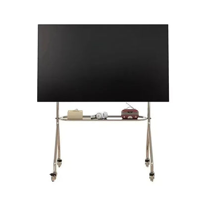Black flat-screen television mounted on a stainless steel tv stand with storage shelf lockable wheels for living room use
