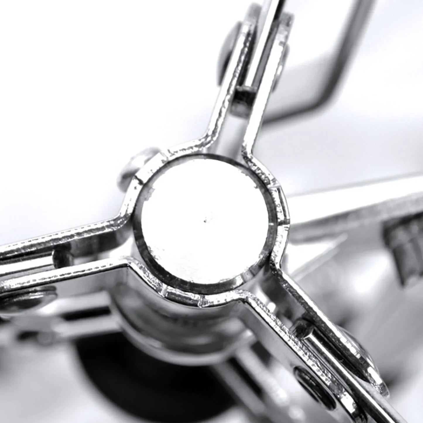 Silver metallic clamp with circular plate and four arms for thickened stable tripod snare drums stand ethereal dumb snare