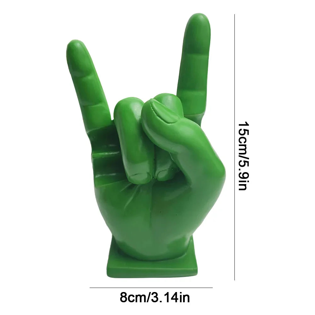 Green resin hand sculpture in rock gesture on square base used as modern drum stick holder and display stand