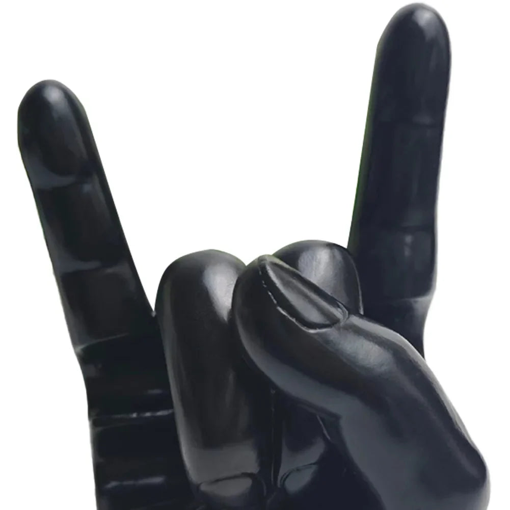 Black glossy resin hand sculpture making rock on sign gesture drum stick holder and modern display stand accessory