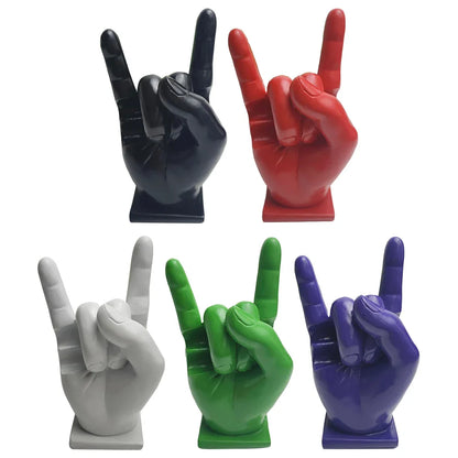 Vibrant glossy resin hand sculptures in black red white green and purple as drum stick holders and display stands