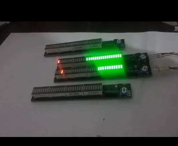 Three illuminated music spectrum led strips mounted on green circuit boards as a 12v 24v amplifier audio level indicator module