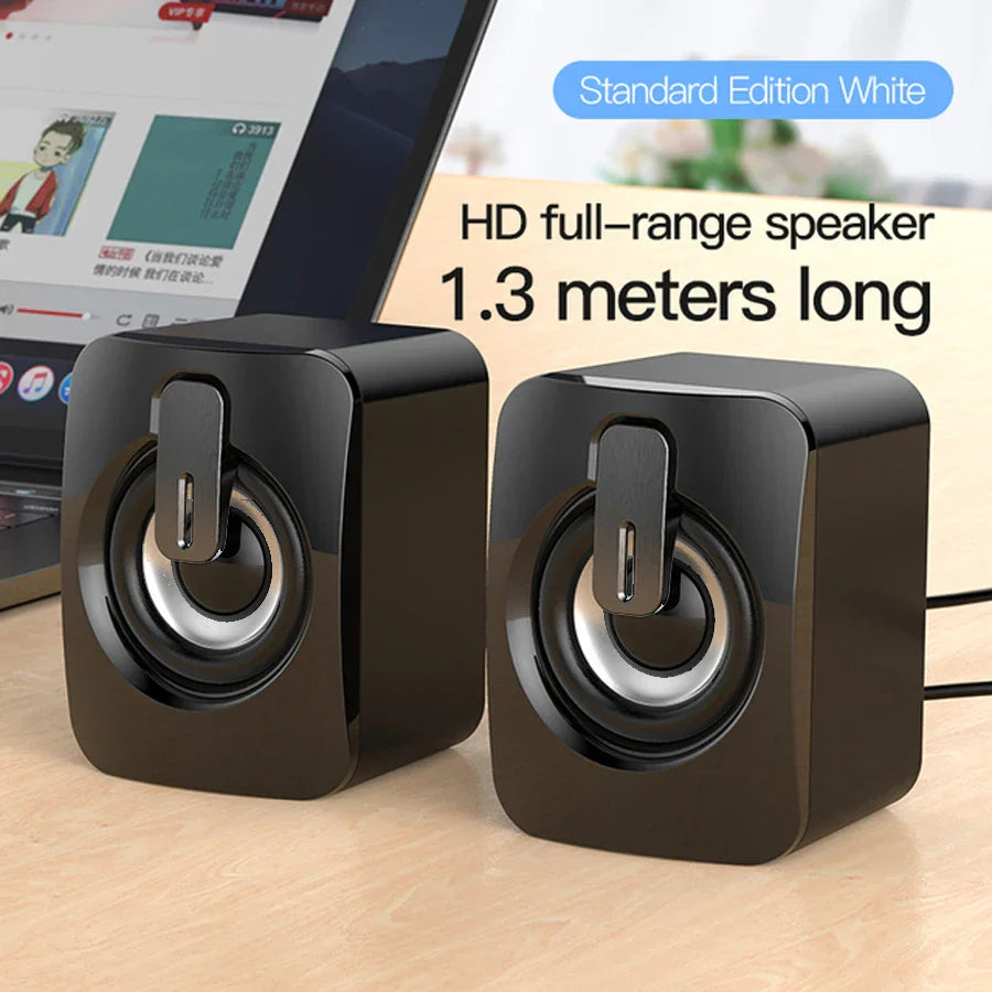 Black glossy-finished mini home musical stereo speaker with silver drivers and control panel for desktop computer laptop pc