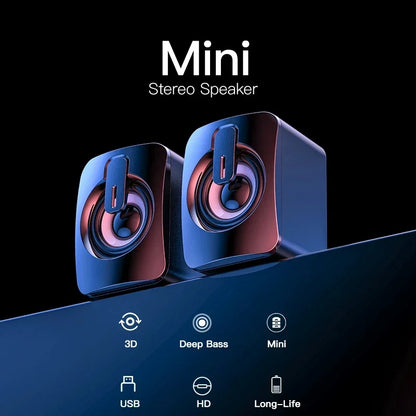 Pair of sleek glossy black notebook wired mini stereo speakers with vibrant blue and pink illuminated drivers for home musical music som portable altavoces