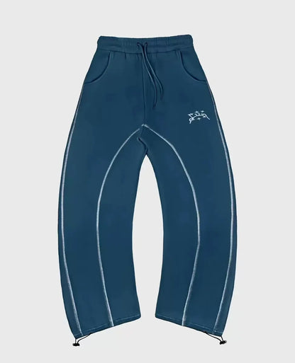 Dark teal sweatpants with light blue contrast stitching and white logo complement patterned oversized sweatshirts casual hoodies