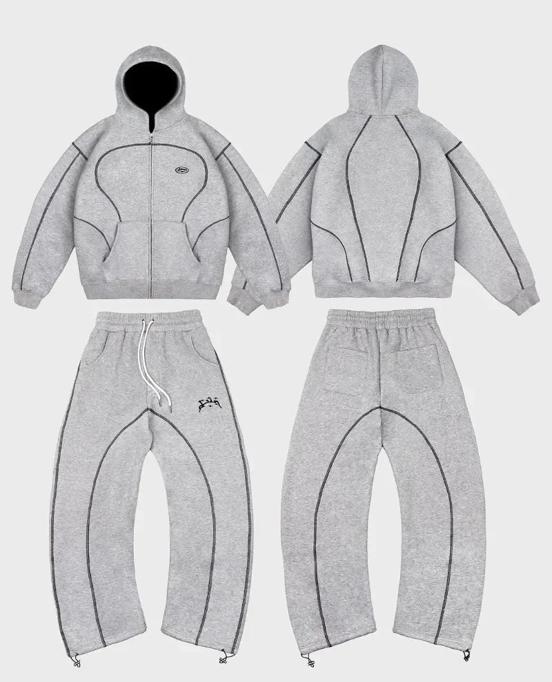 Gray heathered hoodie and sweatpants set with black stitched paneling featuring trendy silhouettes unique hip-hop style patterns