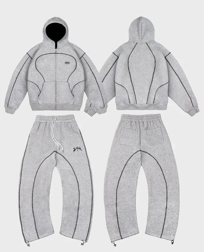 Gray heathered hoodie and sweatpants set with black stitched paneling featuring trendy silhouettes unique hip-hop style patterns