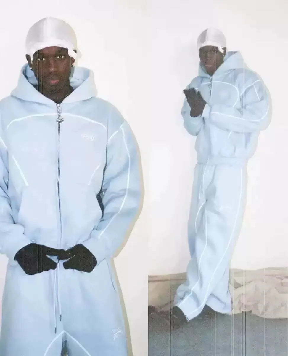 Light blue hooded tracksuit with white piping and small logo combining trendy silhouettes unique patterned oversized sweatshirts