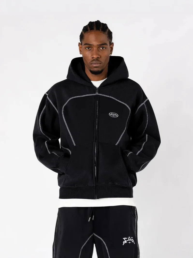 Black zip-up hoodie with contrasting gray stitching and small embroidered logo from trendy silhouettes unique casual hoodies collection