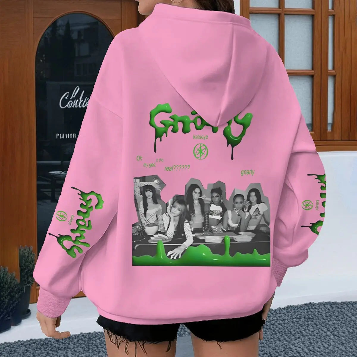 Pink oversized hoodie with green dripping grizzly graphic and black and white band katseye streetwear photo for spring autumn unisex use