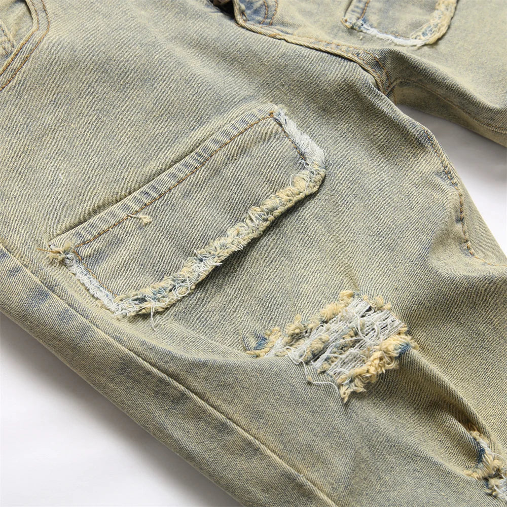 Distressed light-wash denim spliced slim jeans with hip hop holes and frayed details in streetwear retro style for men