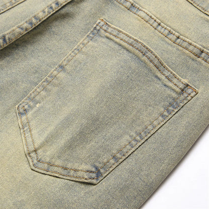 A faded light blue denim pocket with visible stitching on streetwear retro style spliced slim jeans with hip hop holes
