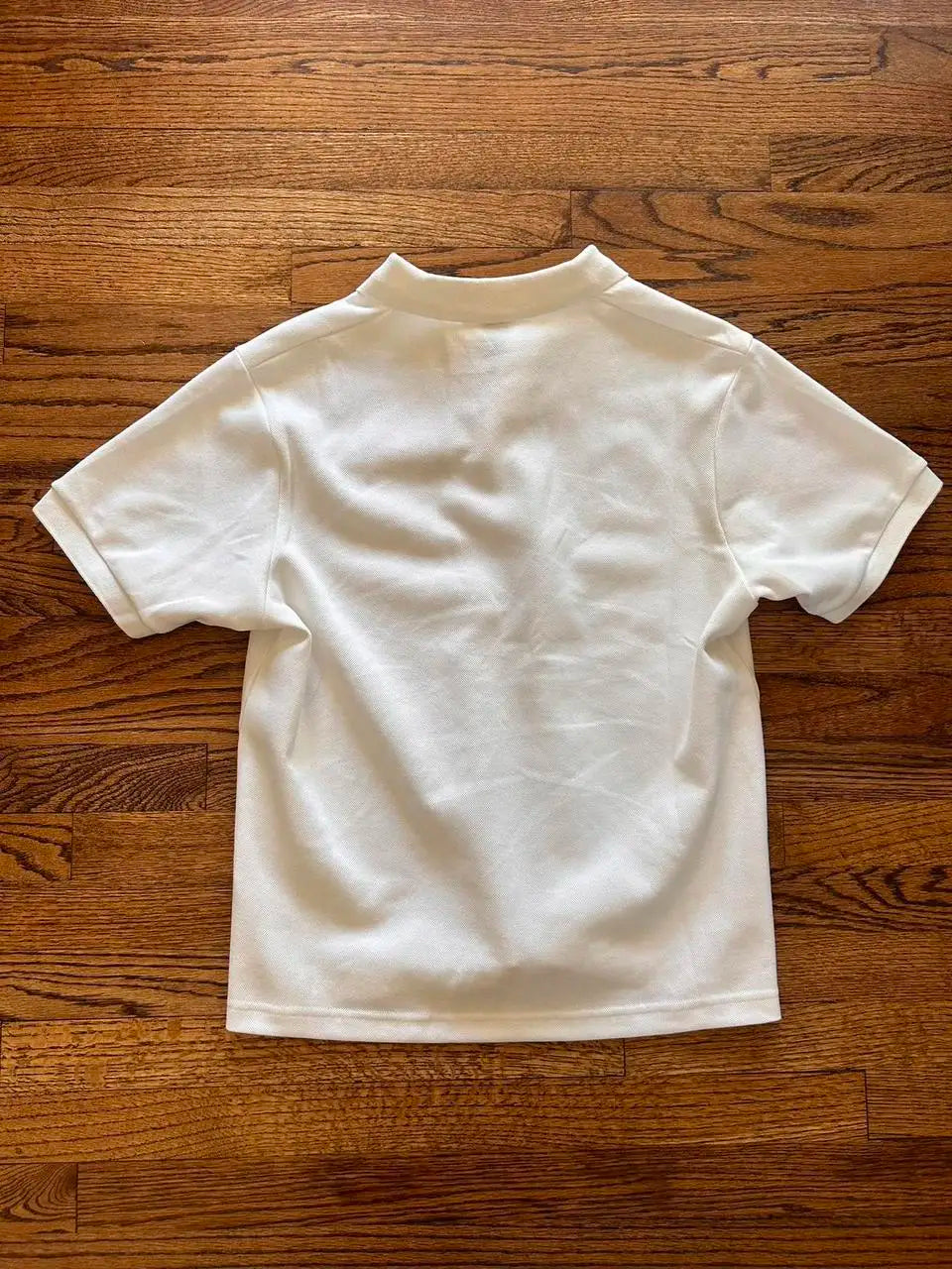 White short-sleeved polo shirt with classic collar and stitched seams for hip hop streetwear shirt y2k clothing style