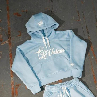 Light blue cropped hoodie with white embroidered logo and matching sweatpants in a y2k clothes mens piece set y2k