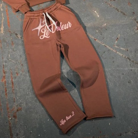 Brown sweatpants with white embroidered le voleur logo and less than 2 text in streetwear two piece set y2k clothes mens
