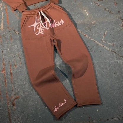 Brown sweatpants with white embroidered le voleur logo and less than 2 text in streetwear two piece set y2k clothes mens