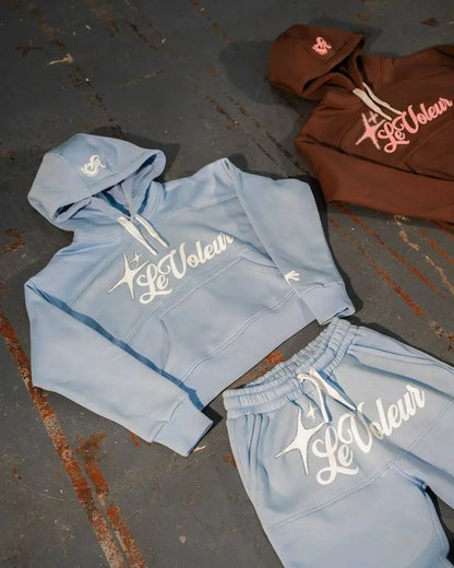 Light blue cropped hoodie and matching sweatpants set with white le voleur logo featuring star design y2k clothes mens piece set