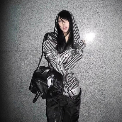 Black leather backpack with studded details and visible brand tag styled with hip hop y2k stripe harajuku hip hoodie grunge goth