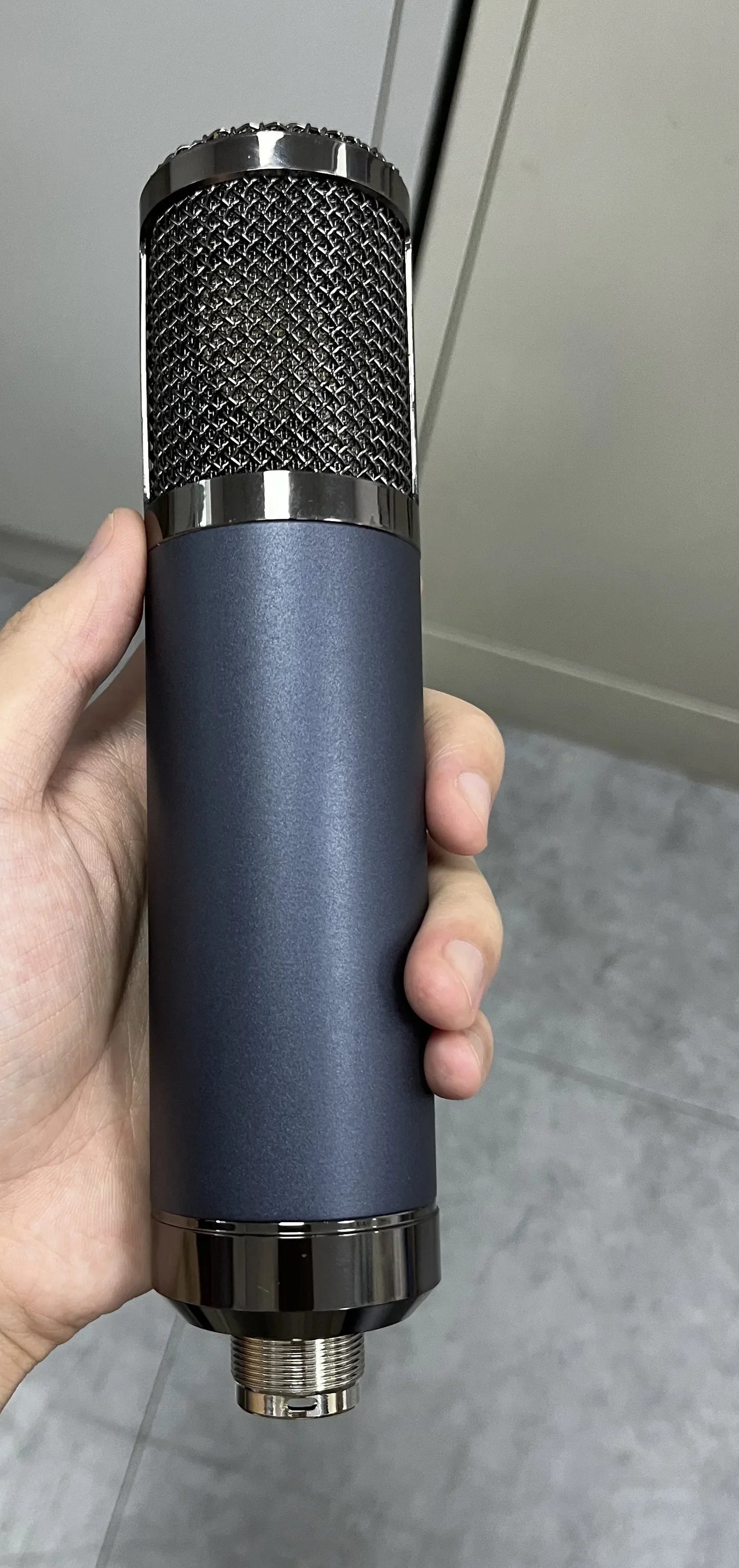 A sleek matte navy blue studio microphone shell with metallic mesh grille for diy microphone parts type beat music