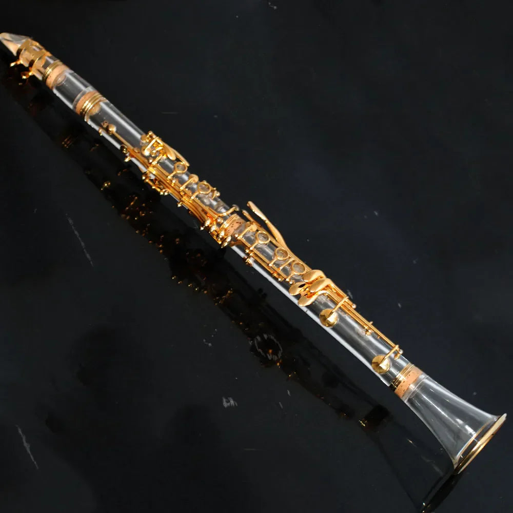 Stylish transparent clarinet with clear body and gold-plated bb17 keys featuring a sleek modern design