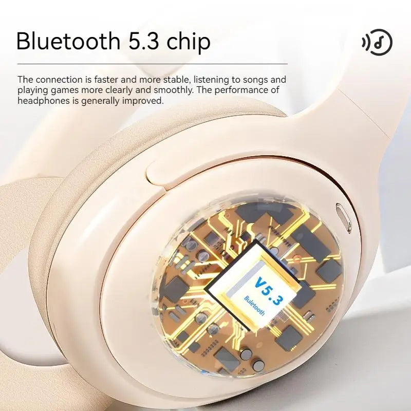 Cream-colored subwoofer gaming wireless over-ear headphones with transparent panel showing gold circuit board and bluetooth chip