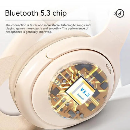 Cream-colored subwoofer gaming wireless over-ear headphones with transparent panel showing gold circuit board and bluetooth chip