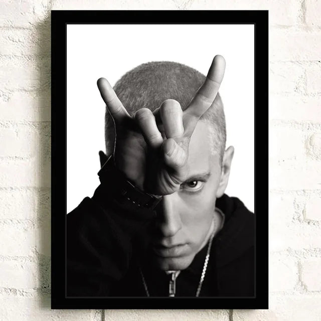 Black-framed black-and-white super rapper eminem portrait print with hand gesture ideal for bedroom wall decor color change