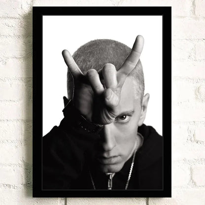 Black-framed black-and-white super rapper eminem portrait print with hand gesture ideal for bedroom wall decor color change