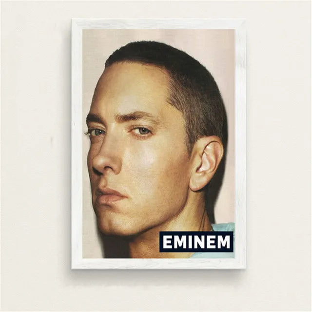 White-framed Eminem portrait print with black and white text label for bedroom wall art with subtle color change effects