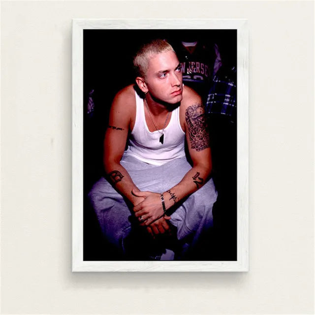 White-framed canvas painting of eminem in a white tank top with tattoos for bedroom wall art featuring color change effect