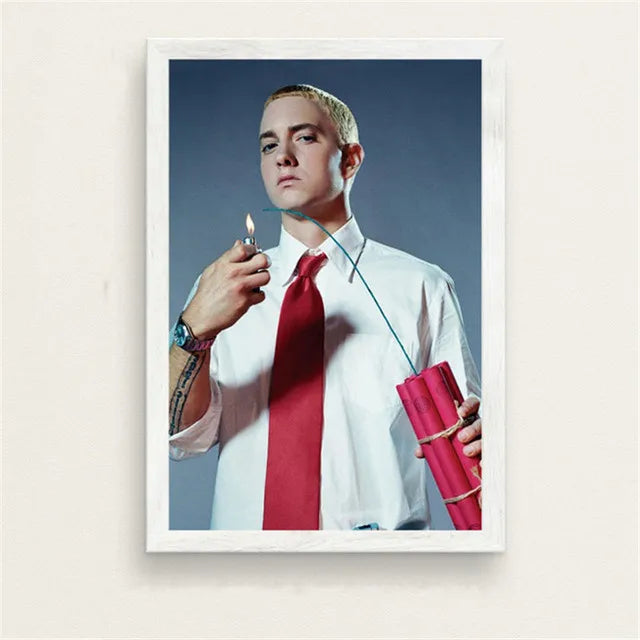 White-framed poster of eminem in white shirt and red tie holding pink dynamite with lit lighter for color change wall art