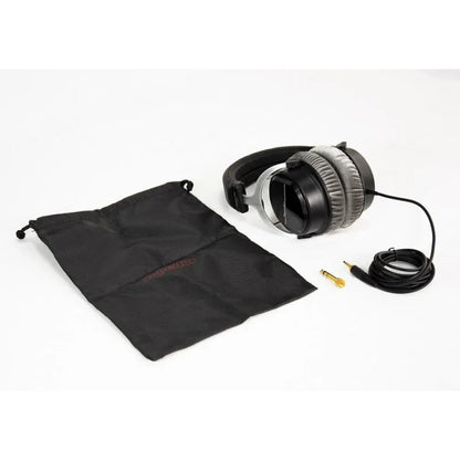 Black and silver Superlux hd660pro professional studio closed-back headphones with padded earcups and coiled cable for recording monitoring broadcast