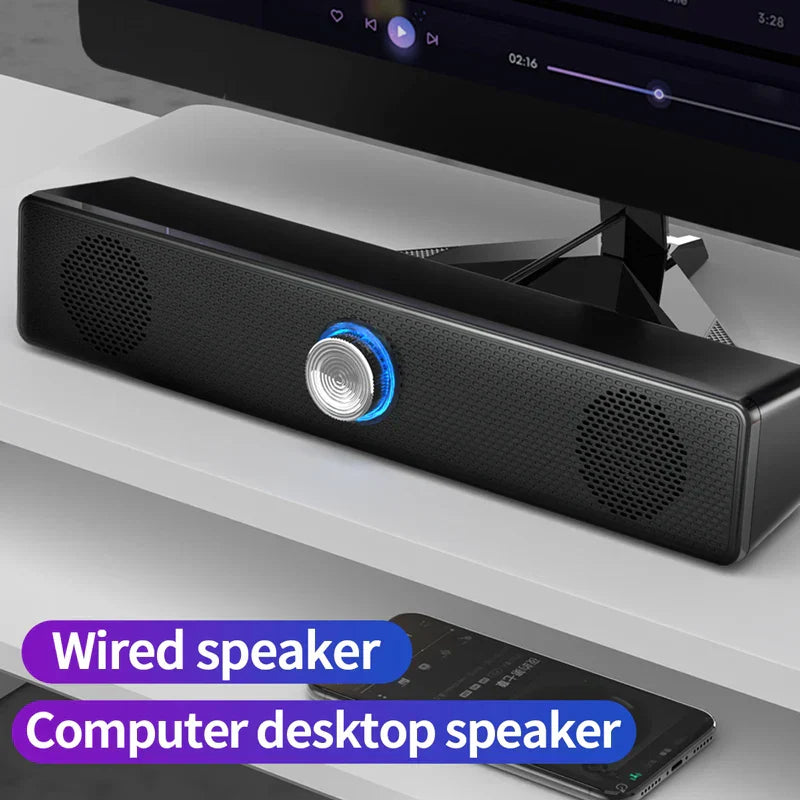 Black rectangular wired subwoofer stereo with blue-lit silver control button and perforated grilles for surround speaker home use