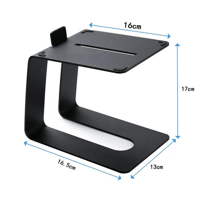 Black metal tabletop speaker stand with a minimalist c shaped design 16.5x13x17cm tilted for better audio quality