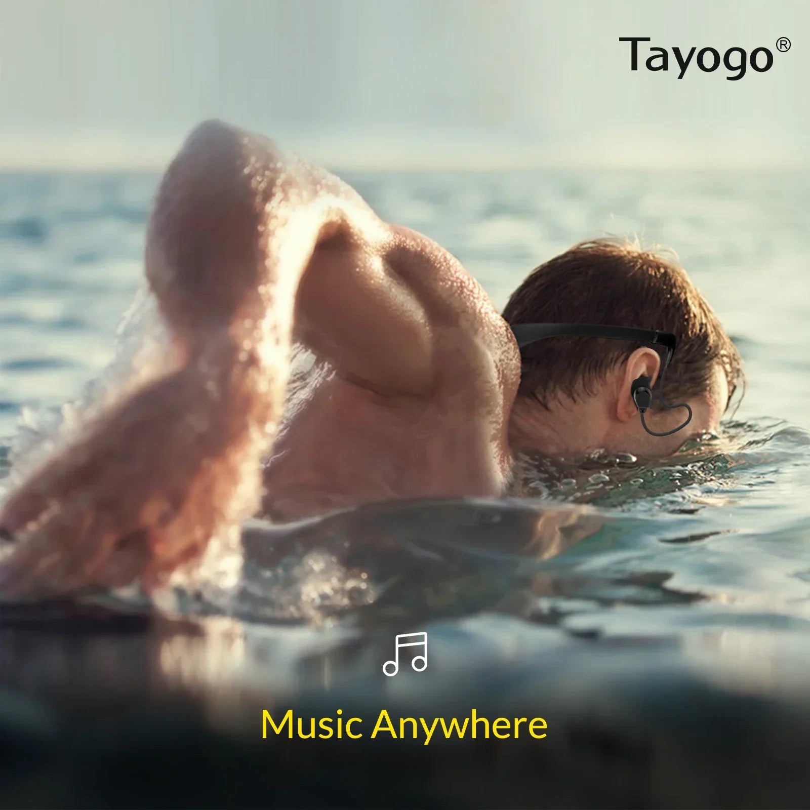 Black tayogo waterproof mp3 swimming ipx8 8gb earbud with silicone coated waterproof design worn by swimmer in water